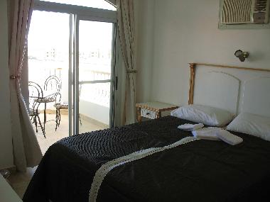 Master Bedroom with Patio doors to balcony and plenty of wardrobes space