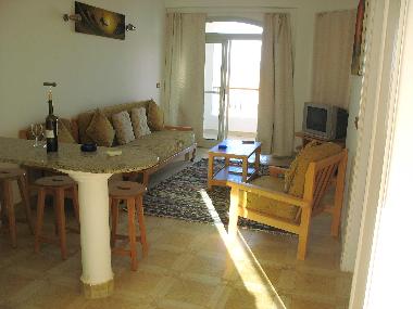 Living room with patio doors out to balcony.Plus double sofa bed