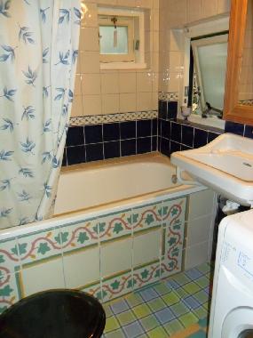 bathroom with bath, shower and toilet.