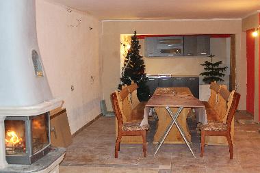 Dining room with a fire place in winter and sport activities in summer