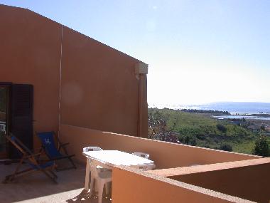 beachview from main patio, with sunchairs and dining table
