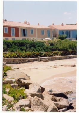 the window of the house is in the yellow house