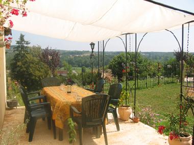 Garden dining terrace with tranquil valley view.