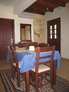 The dining table has an insert and seats 8.