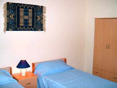 A Typical bedroom with twin beds with all bedding provided