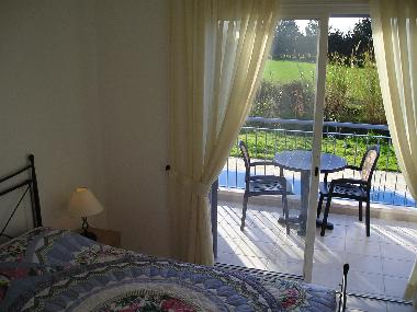 Double bedroom with balcony overlooking the pool