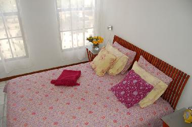Queen bedroom with designer linens