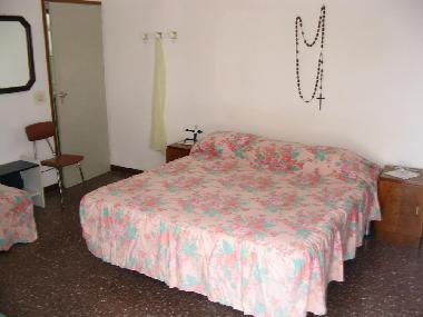 the bedroom, one double bed and 2 singles beds