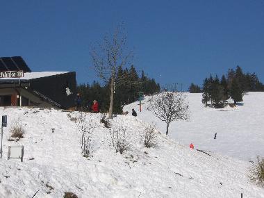 Skiing or snowboarding in winter time at 