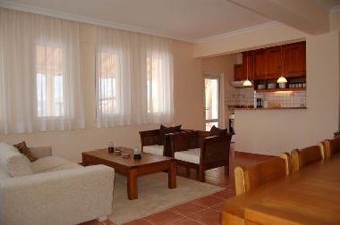 Open plan living dining room with well equipped kitchen