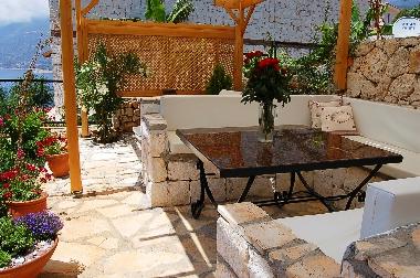 Shaded alfresco dining on the pool terrace