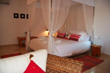 Stylish master bedroom with romantic 4 poster bed