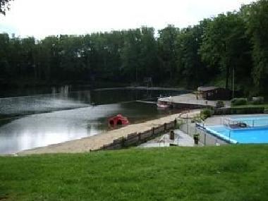 Look to the swimming pool and lake from our garden