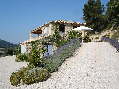 The house is situated freely on a hillside
