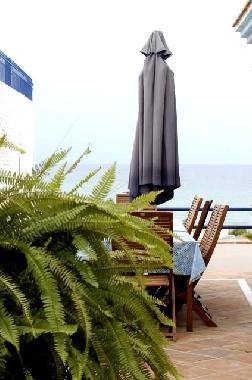 terrace on the first floor by the salon-dinning room with view to the sea