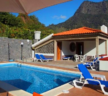 Swimming pool and outdoor area for leisure.