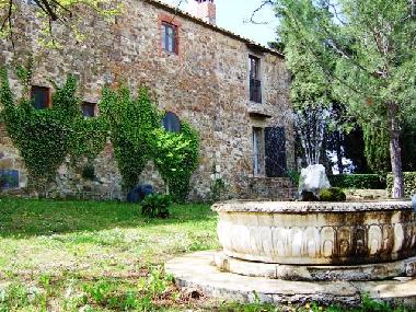 the country house from the panoramic terrace , with the lovely fountain.
