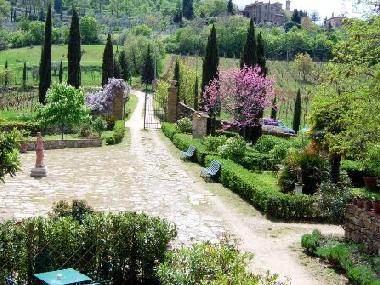 the entrance gate with the romantic italian style garden. all the suites have the private entrance d