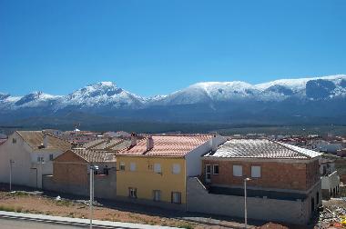 View of snow covered local mountain range from Roof Patio