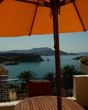 The wooden table on the large balcony is perfect for al fresco dinner or lunch 