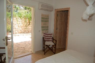 Double bedroom with doors opening onto patio