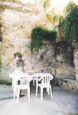 Next to the kitchen you find this yard with a 2000 years cave