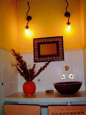Sink and mirror in bathroom 1