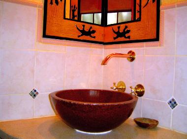 Basin and mirror in bathroom 2