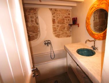 bathroom downstairs with well sized bath tub