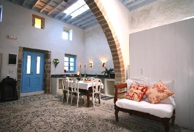 dining, living and big arch (kamarra), rooflight, and doors opening to courtyard