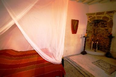 fireplace in bedroom downstairs, pebbled floors