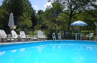 Swimming pool in orchard with valley view