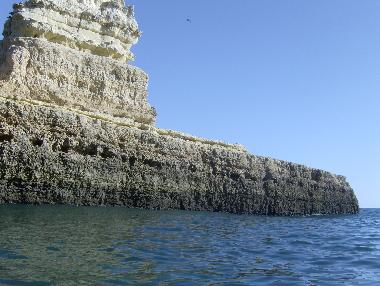 Take a boat trip to explore the caves from the beach 