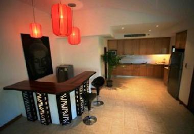 The bar area and the kitchen