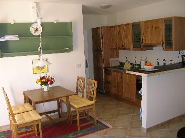 Kitchen with diningtable.