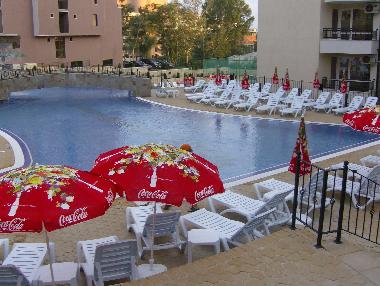 Big pool, taken from the Restaurant. The Jacuzzi is tucked behind the left hand Parasol