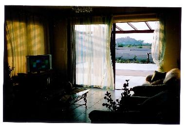 Lounge area leading onto the veranda around the pool