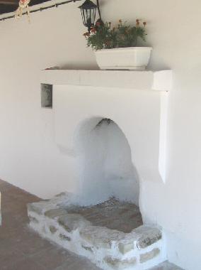 Fireplace in covered barbecue area