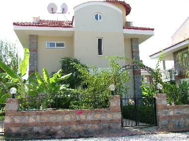 Front of Villa, gardens and driveway