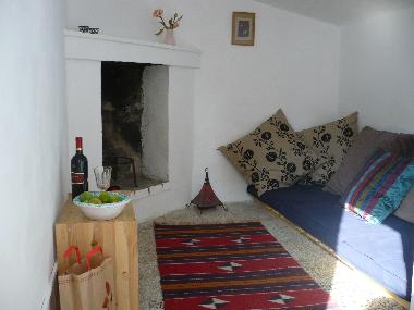 Small room with futon leading onto roof terrace.