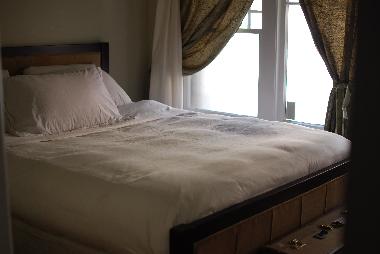 A full wall of windows provides plenty of light in the Master!