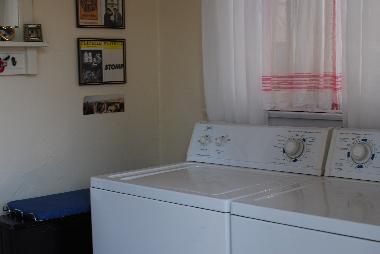 Over sized Kenmore washer and dryer, in the laundry room.