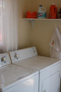 Laundry room, off of the kitchen and leading to the back door.