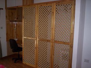 ( A ) - Warbrobe- well ventilated which is imporatmt with Seychelles Climate. Desk area as well.
