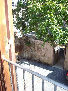 Courtyard in front of the house, view from second floor Juliet window