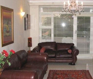Modern genuine leather lounge suite, porcelain tiled, opens onto balcony with lovely harbour/sea vie
