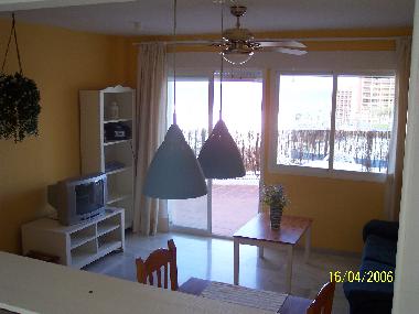 Nice livingroom with satelite TV and exit to the terrace.