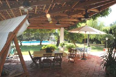 Veranda with view of the garden and the pool