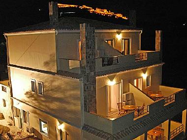 Aanthemion Guest House.  A night shot with Palamidi in the background.