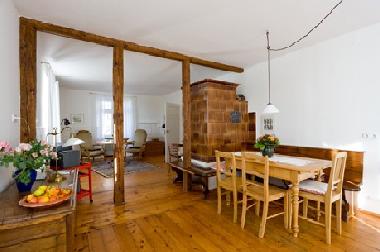 dining room with old tiled stove